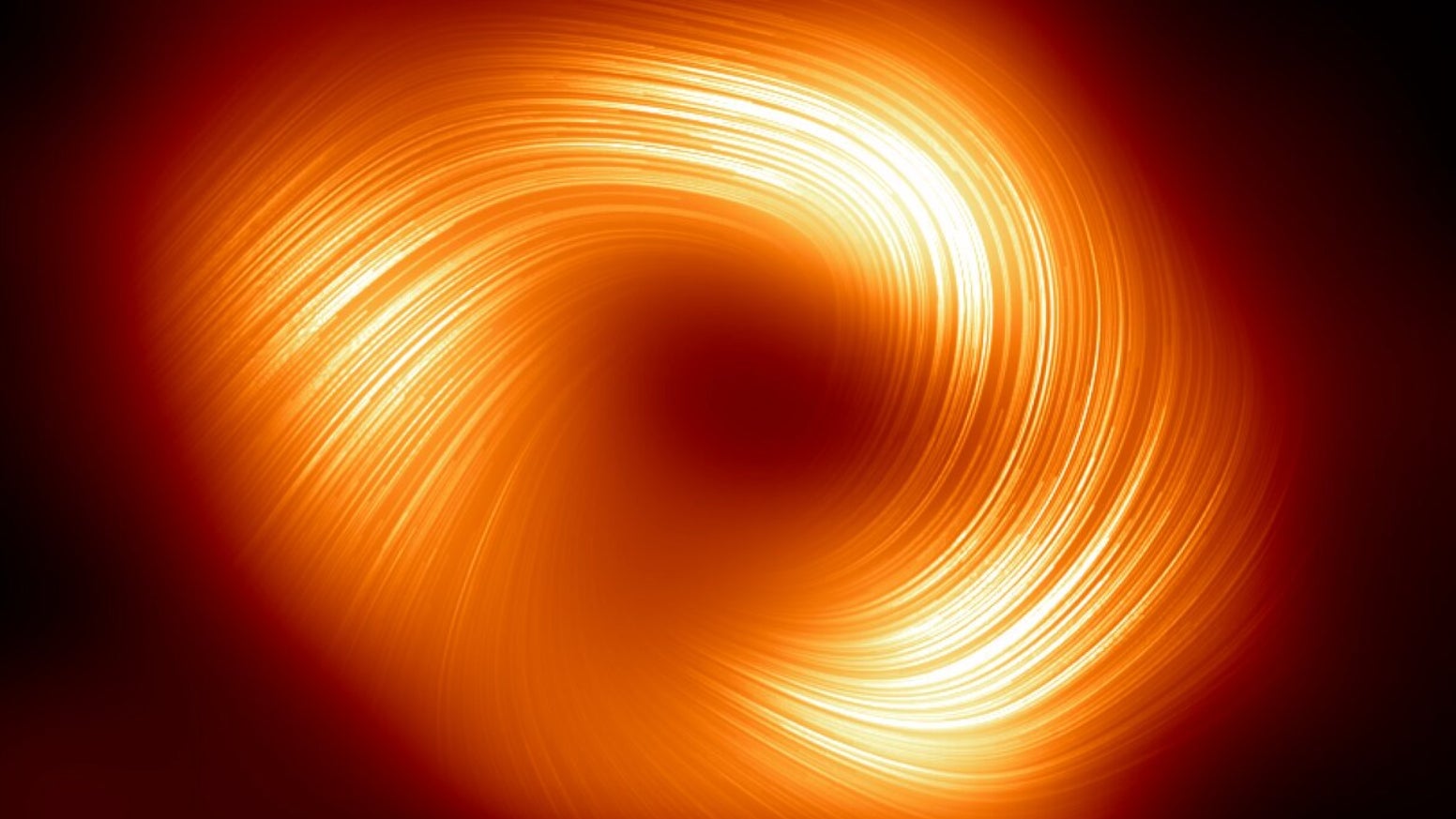 Schütze A* im polarisierten Licht zeigt Magnetfeldlinien rund um das Schwarze Loch.