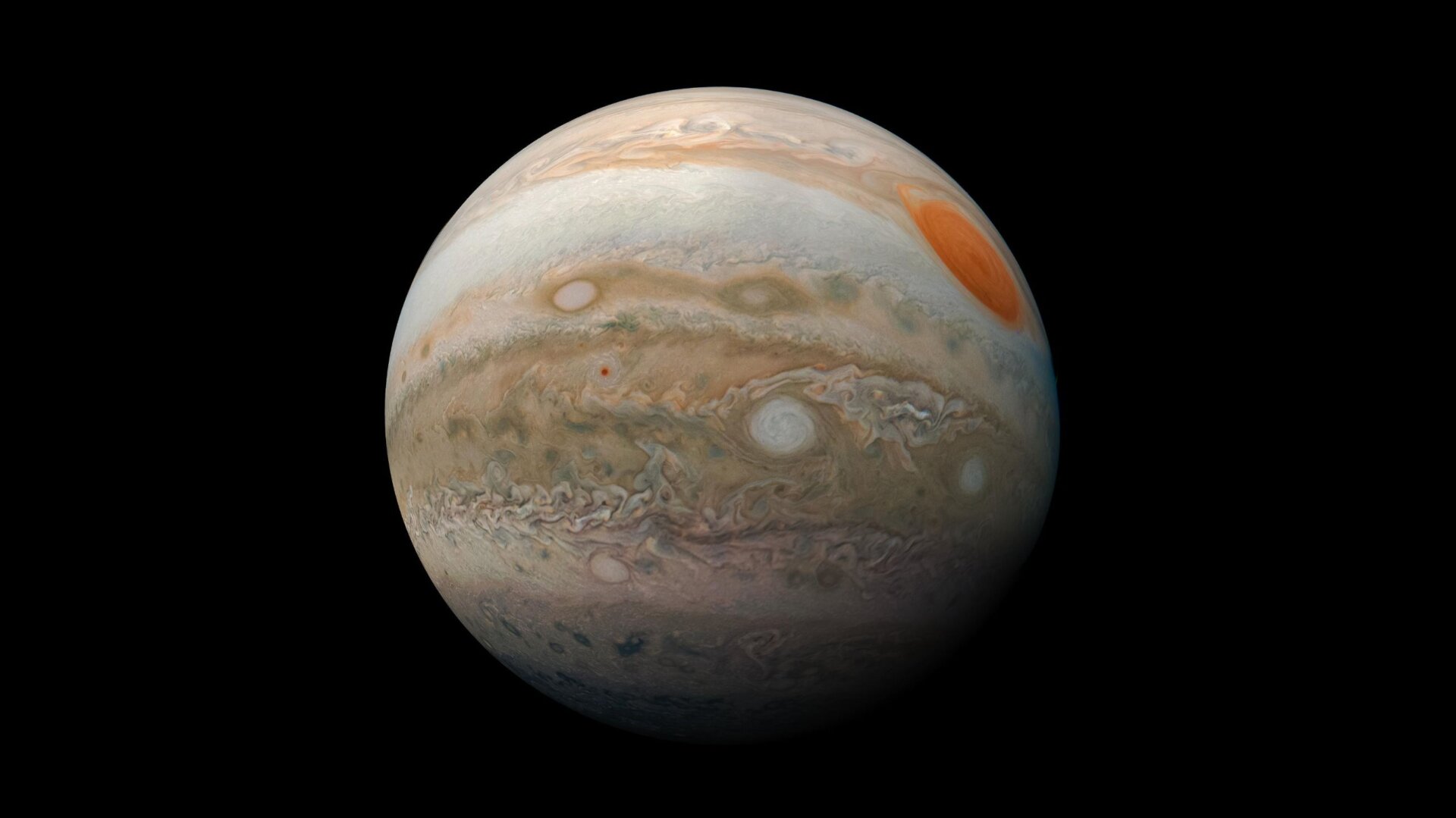 Jupiter, wie er von Juno gesehen wird, sein Großer Roter Fleck ist rechts sichtbar.