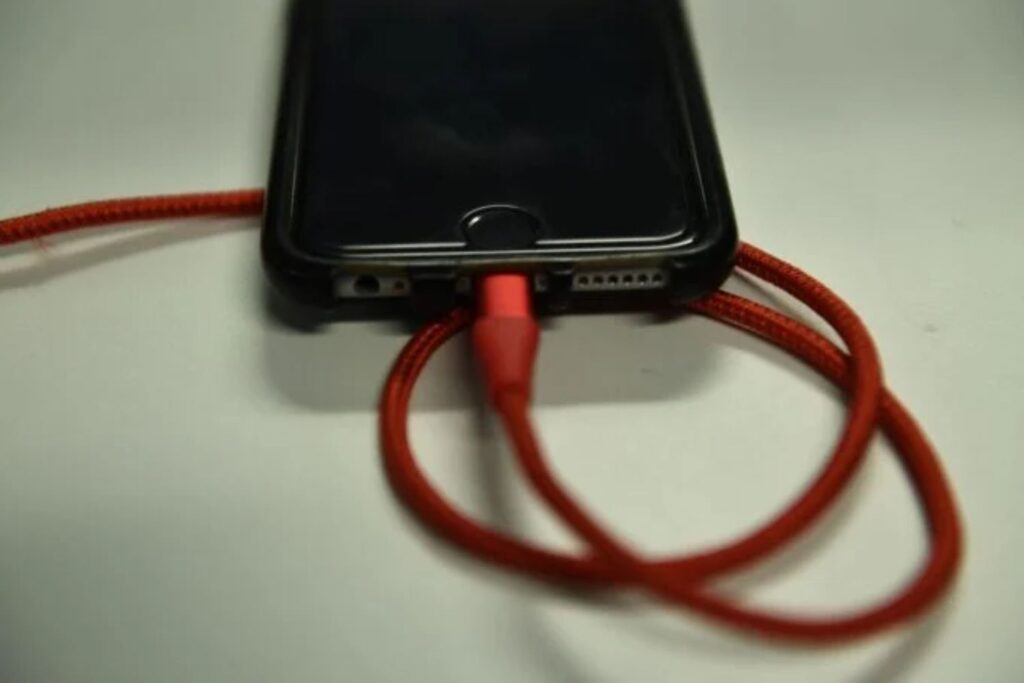 An Iphone 6s Is Plugged Into A Battery Charger On March 18, 2019 In Washington,dc.